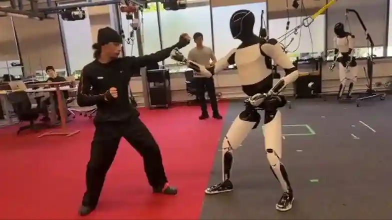 Elon Musk releases video of Tesla Optimus robot learning martial arts and fighting human